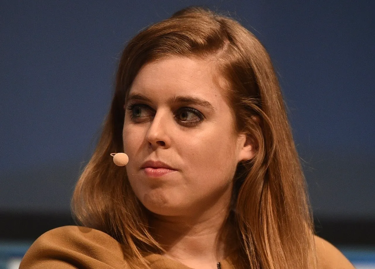 Princess Beatrice speaking at an event with a microphone headset, focused on sharing insights on fashion influence.
