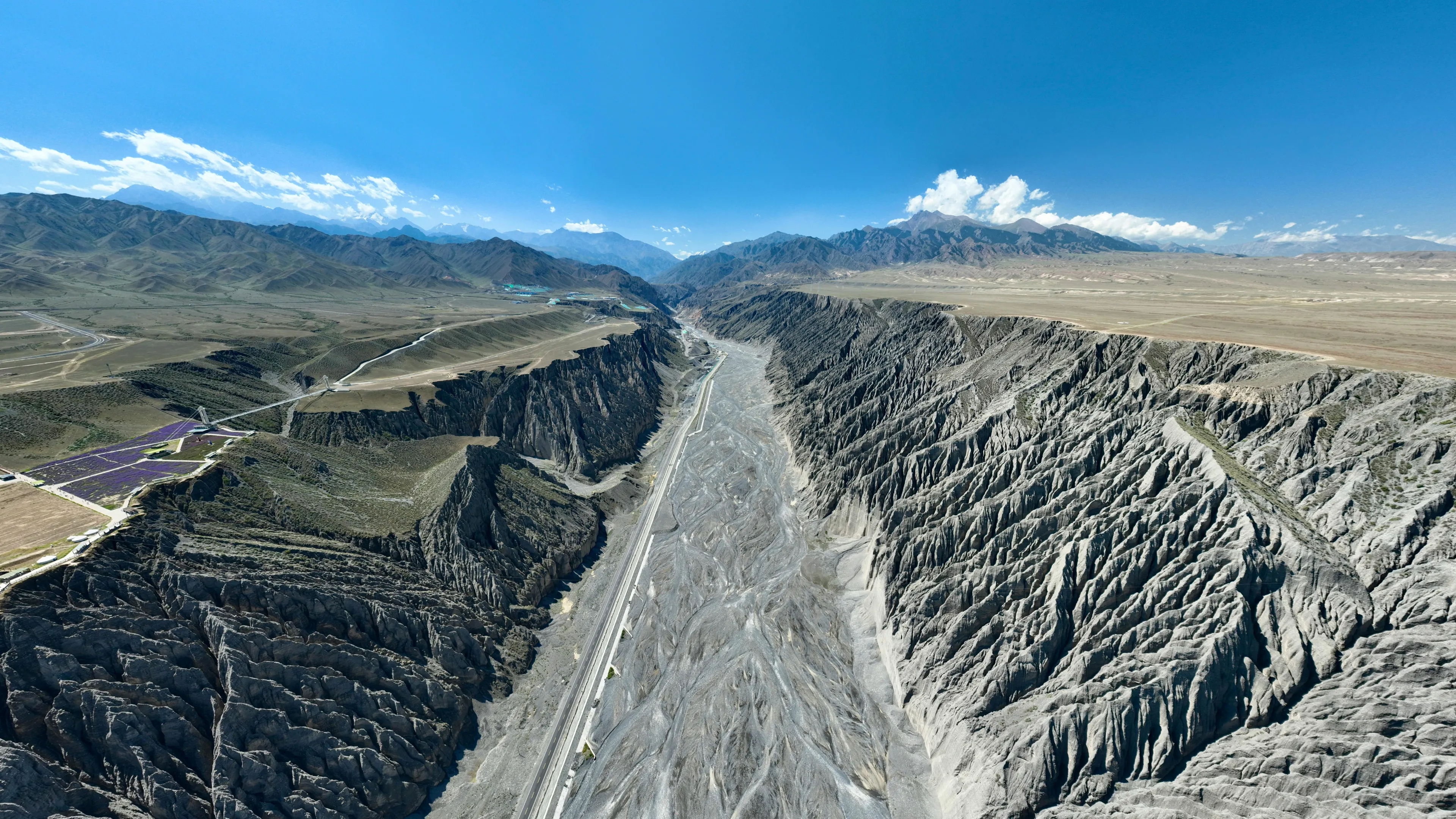 Aerial view of a dry riverbed and rugged terrain illustrating tectonic plates and a transform plate boundary.