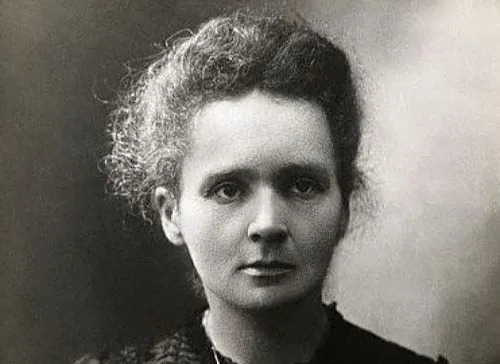 Black and white portrait of a female scientist associated with photons and quantized energy concepts.