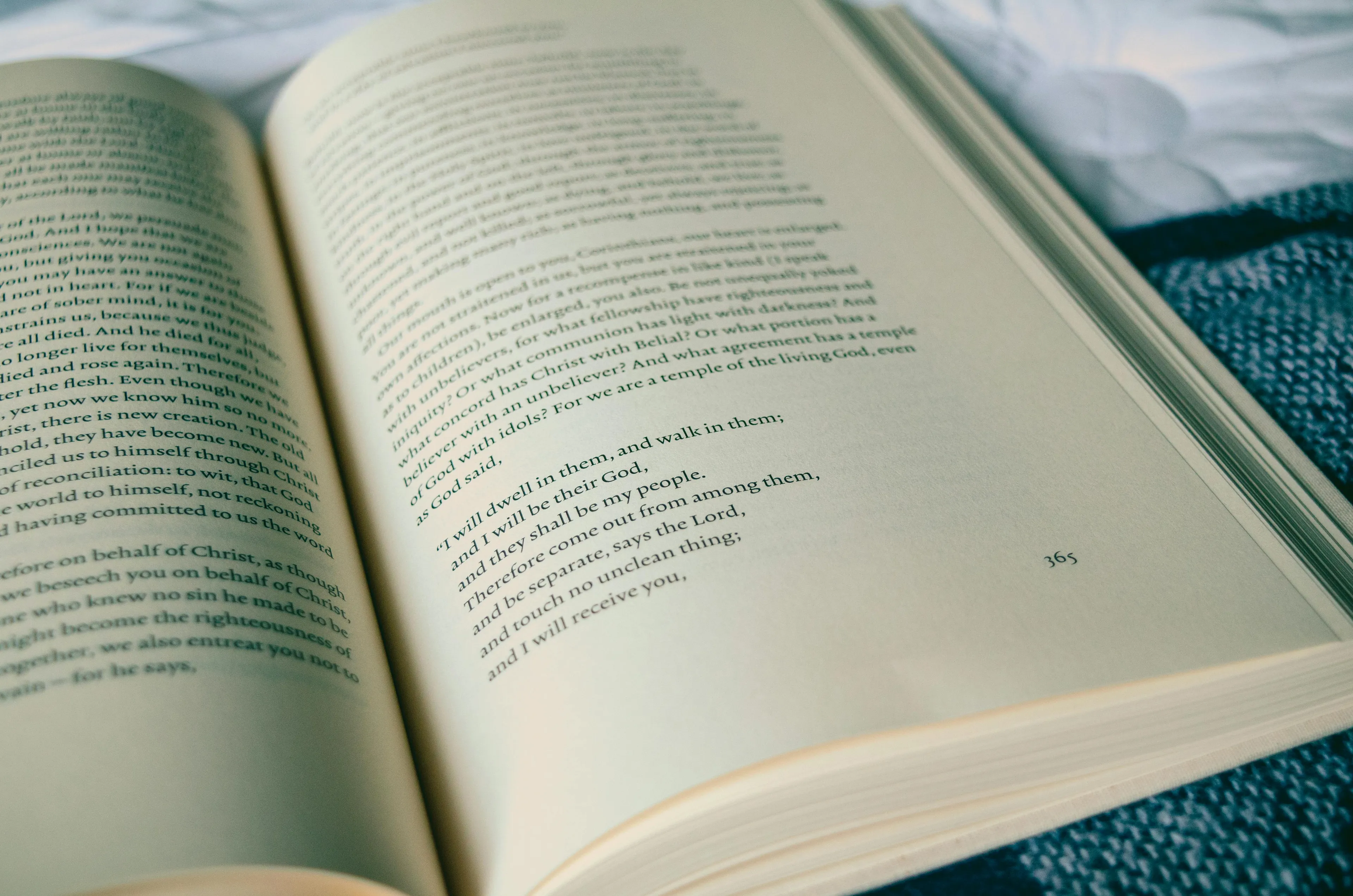 Open book with text visible on pages, related to the $12,000 question about which author wrote Wuthering Heights.