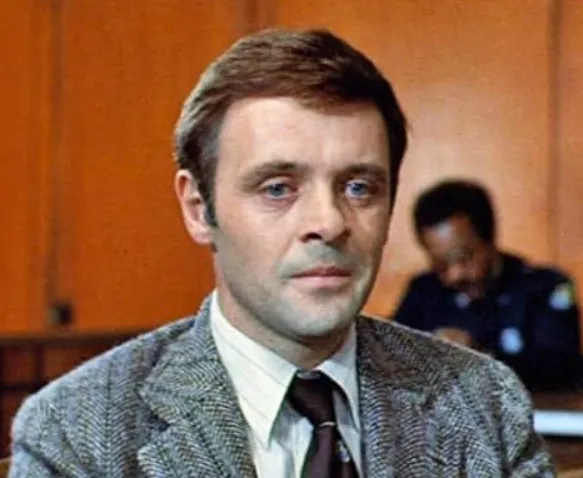 Man in a vintage suit and tie portraying a character from Scarface 1983, with focus on main role casting.