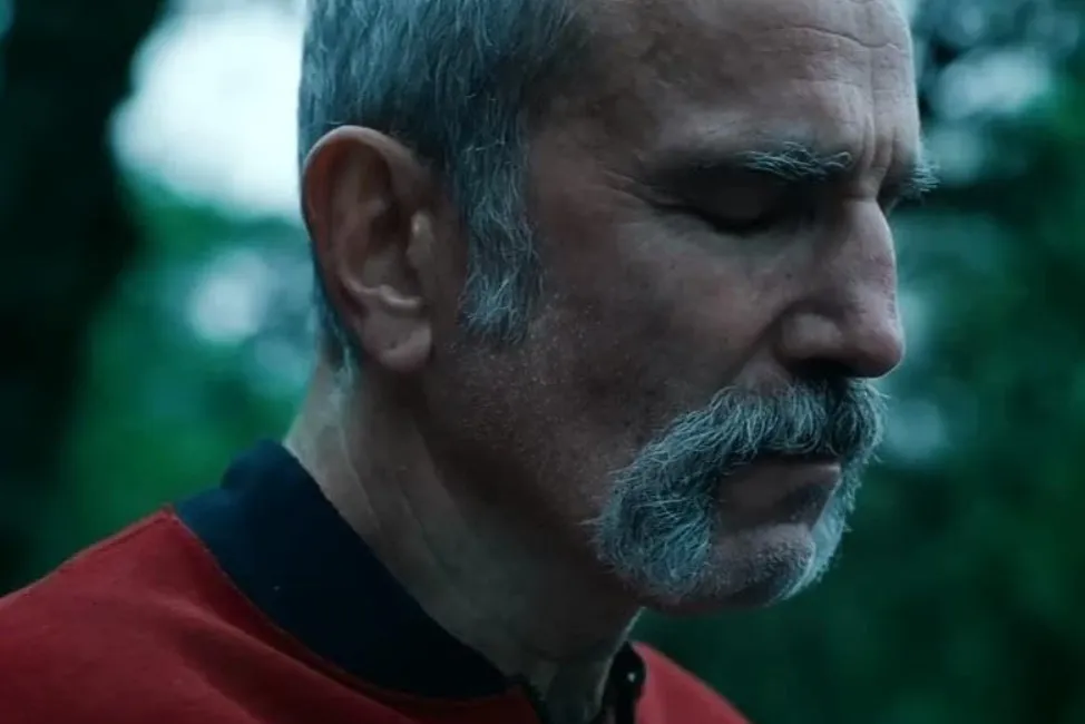 Close-up of an actor with a mustache and eyes closed, relating to WWE wrestler and actor Daniel Day-Lewis discussion.
