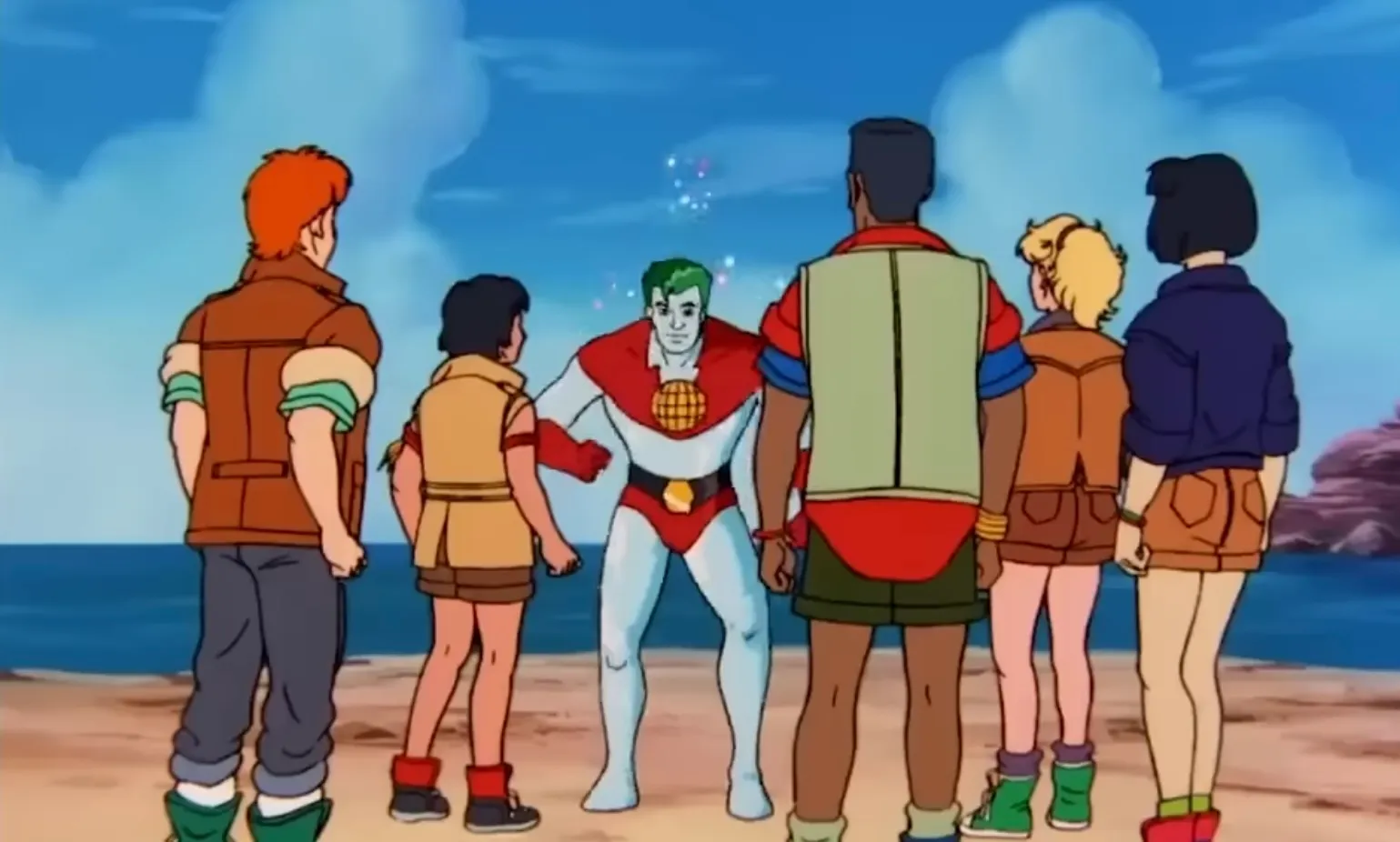 Captain Planet and the Planeteers characters on a beach with blue sky, showing unique 90s cartoon environmental heroes.