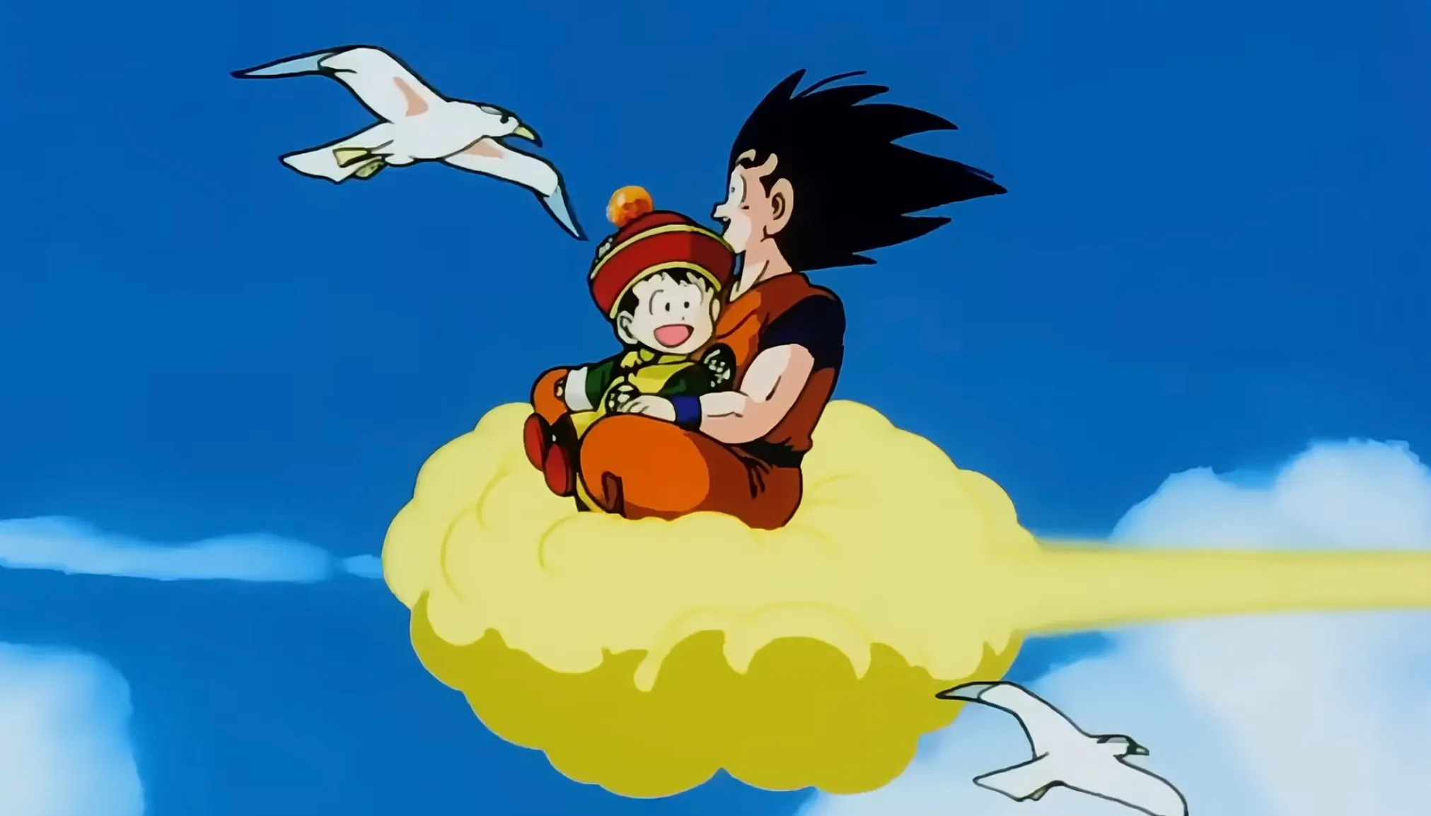 Goku and Gohan flying on the yellow cloud in Dragon Ball Z anime, showcasing 90s TV global hit appeal.