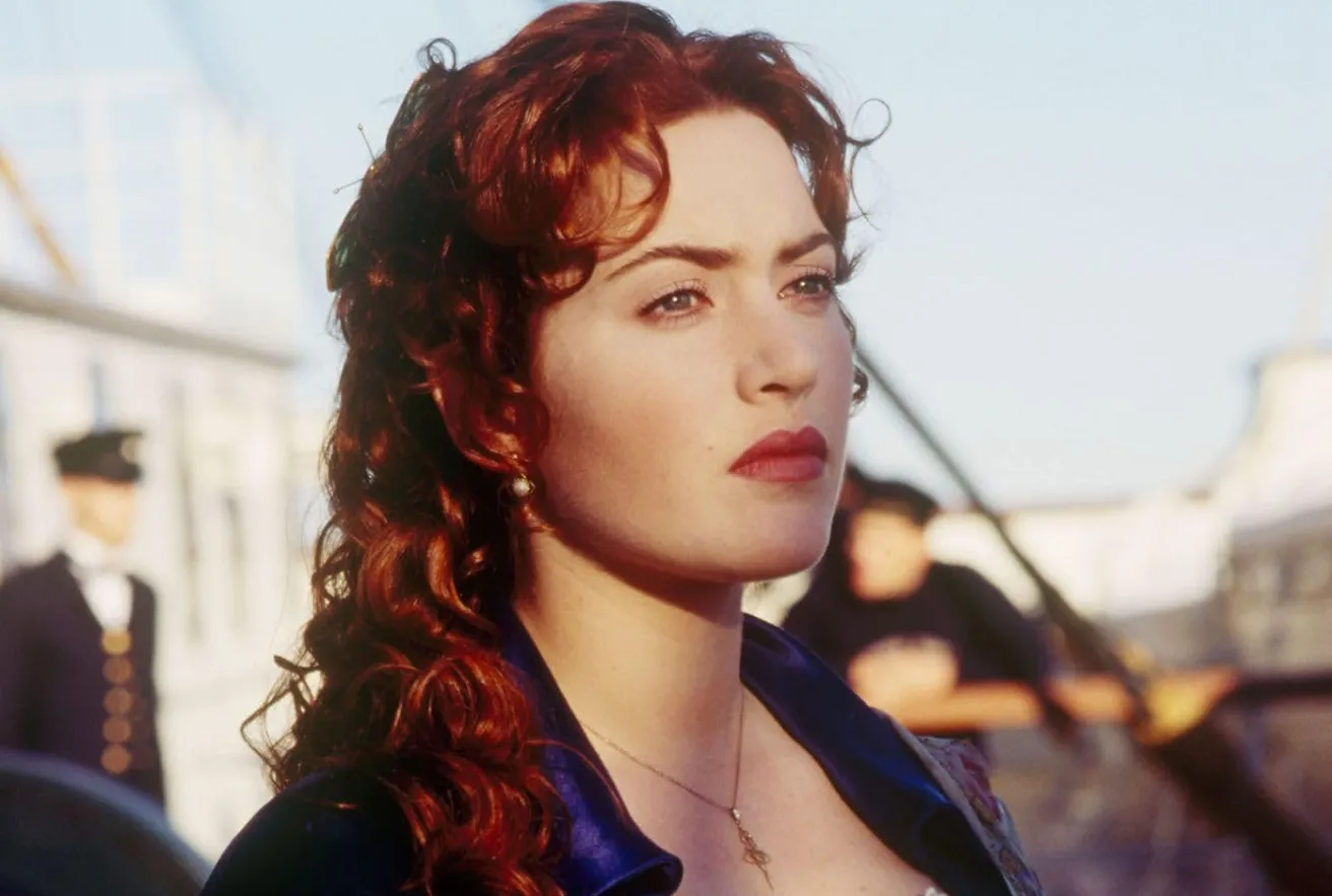 Close-up of Kate Winslet as Rose with red hair in a period costume from the Titanic film, not Twilight franchise.