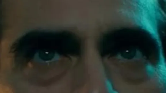Close-up of intense celebrity eyes with dramatic lighting, focusing on the peepers for celebrity eyes guessing game.