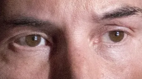 Close-up of a celebrity's brown eyes making direct eye contact with the viewer in a candid moment.