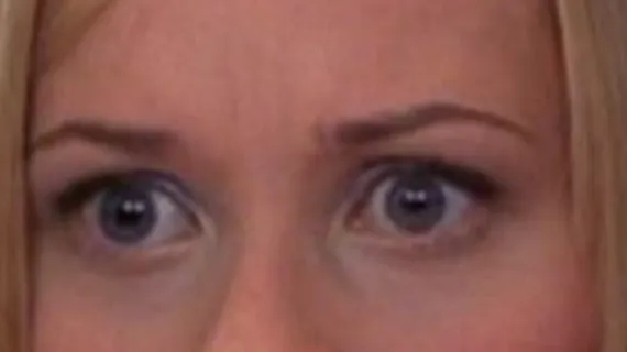 Close-up of celebrity eyes with blue irises, blonde hair framing the face, focusing on identifying the celebrity eyes.