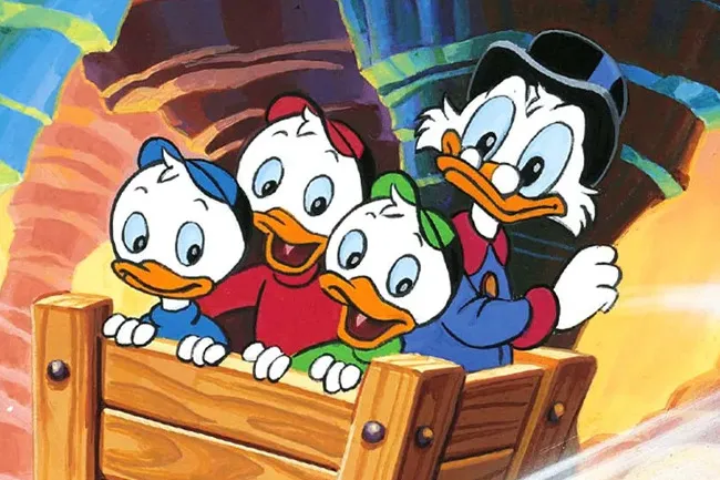Animated scene from DuckTales featuring Scrooge McDuck and his nephews in a wooden cart on an adventurous ride.