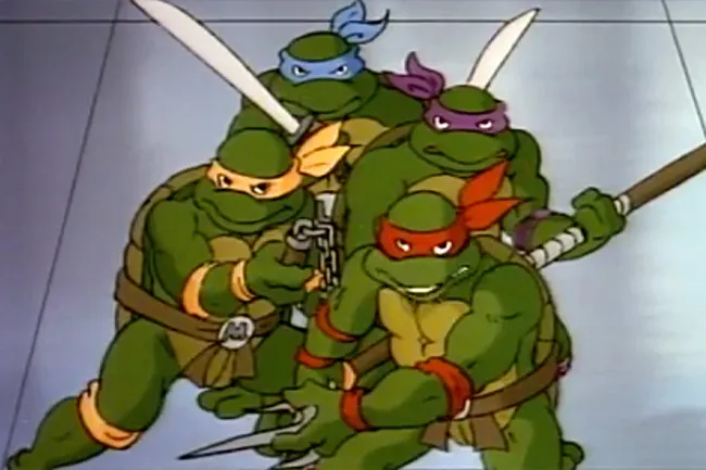 Teenage Mutant Ninja Turtles in action, showing their signature colored masks and weapons in a classic cartoon scene.