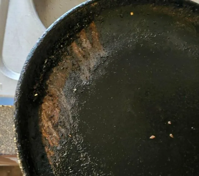 Wife Thought My Favorite Iron Griddle Got Too Dirty And Tried Cleaning It With A Sharp Metal Scraper