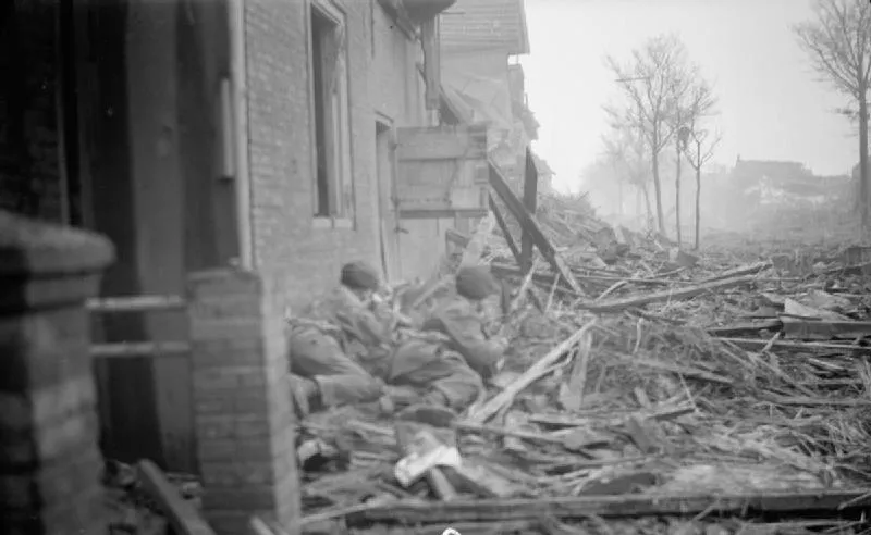 Two soldiers in World War II gear among rubble, illustrating factors contributing to the start of the Cold War after WWII.