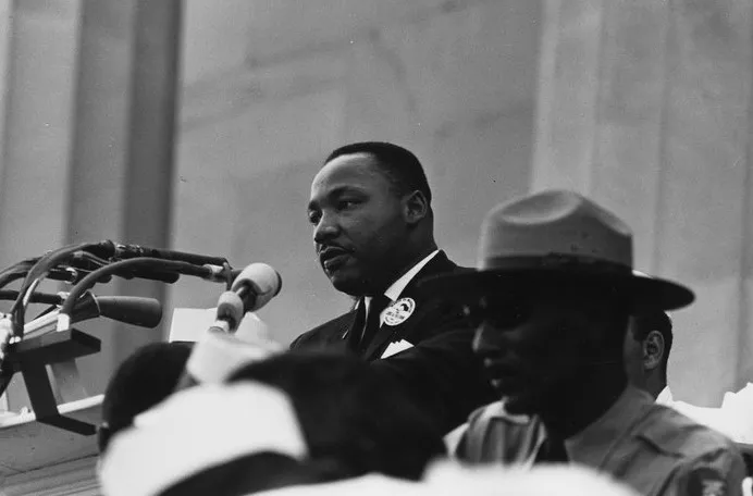 Martin Luther King Jr. delivering a speech, symbolizing the main goal of the Civil Rights Movement in the United States.