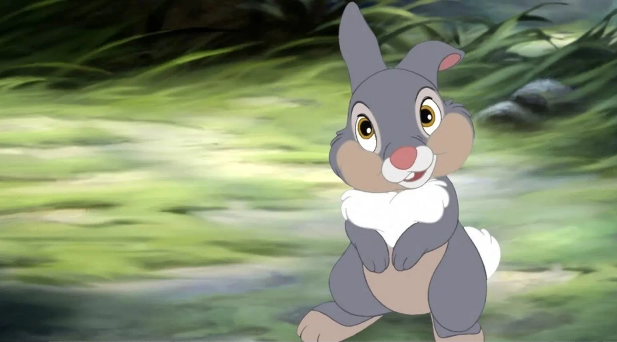 Disney character Thumper from the animated movie appears standing in a forest setting in this scene.