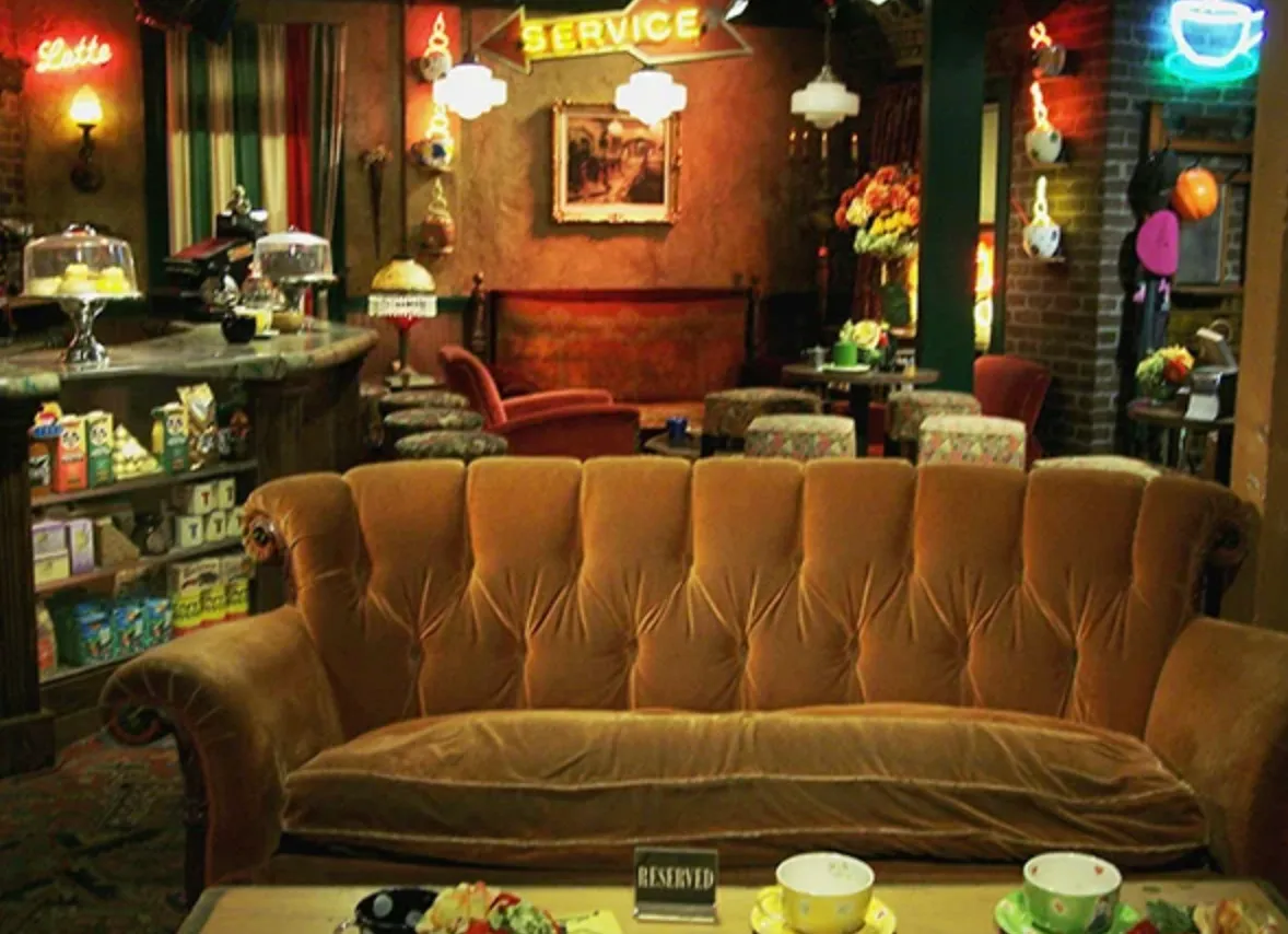 Central perk coffee shop interior with vintage sofa and cozy seating, a fictional location appearing in Friends TV show.