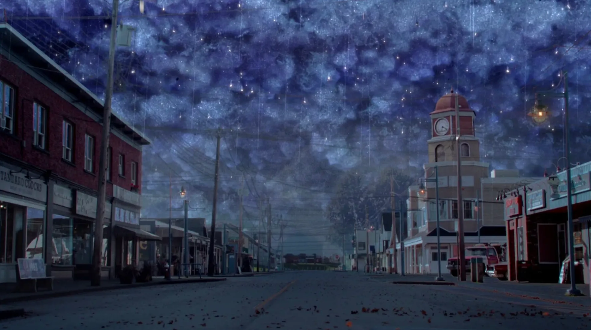 Fictional small coastal town from TV shows under a starry night sky with empty streets and old buildings.