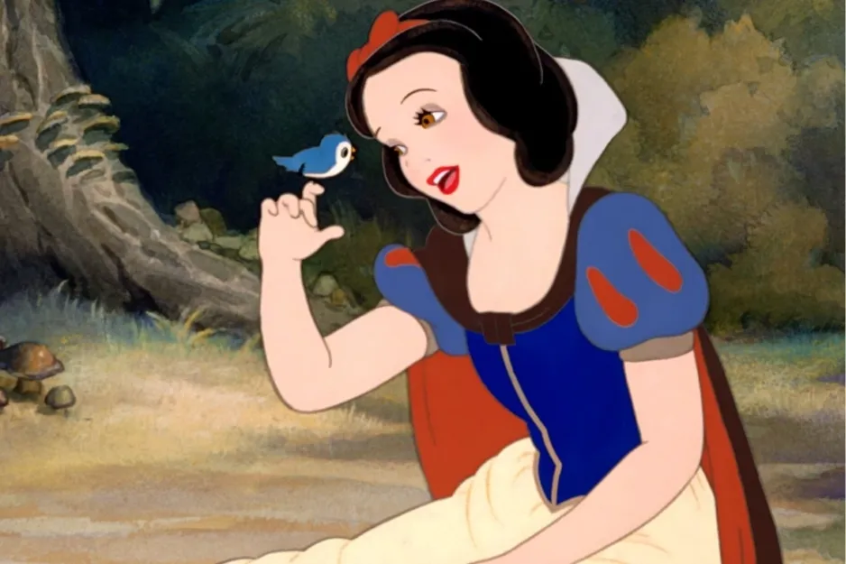 Snow White in classic dress interacts with a small blue bird in a forest scene from the Disney princess story.