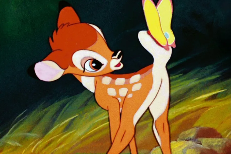 Bambi the young deer with big ears looking at a yellow butterfly in a forest setting at night.