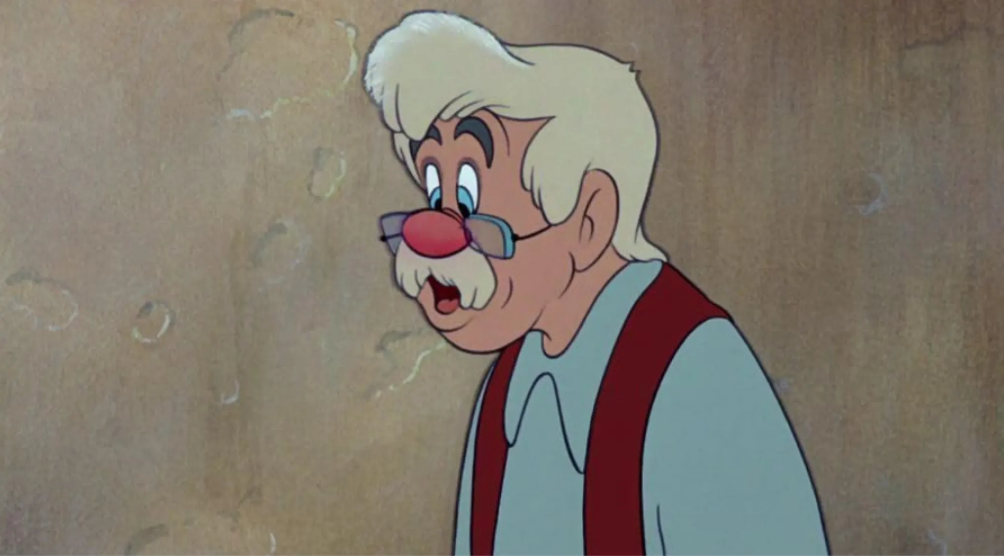 Old Disney character with white hair, glasses, and red suspenders, testing how well you know Disney characters quiz.