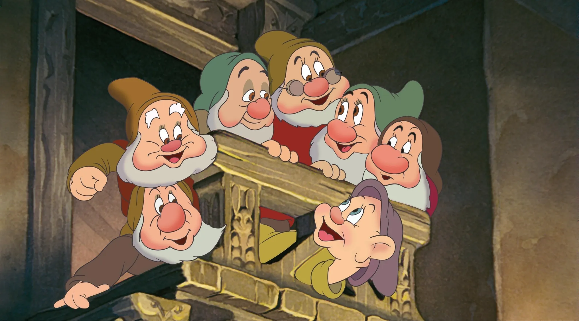 Seven Disney dwarfs looking over a wooden balcony in an animated scene from classic Disney characters.