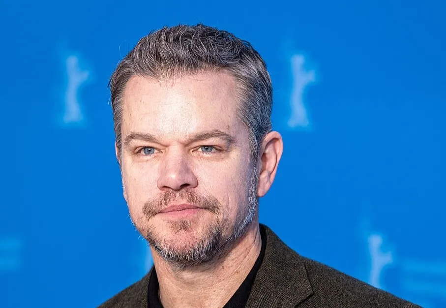 Matt Damon at a film event, with a blue background, focusing on the actor related to Captain Jack Sparrow Pirates of the Caribbean.
