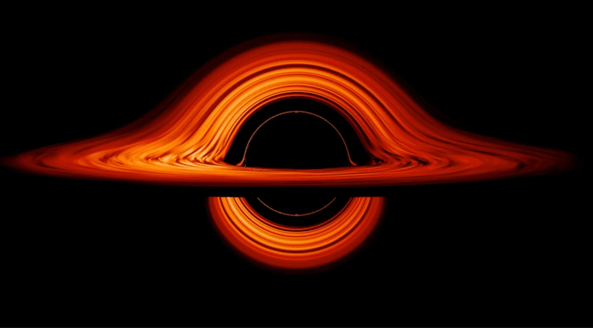Simulation of a black hole showing the glowing accretion disk and the boundary beyond which nothing can escape called the event horizon.