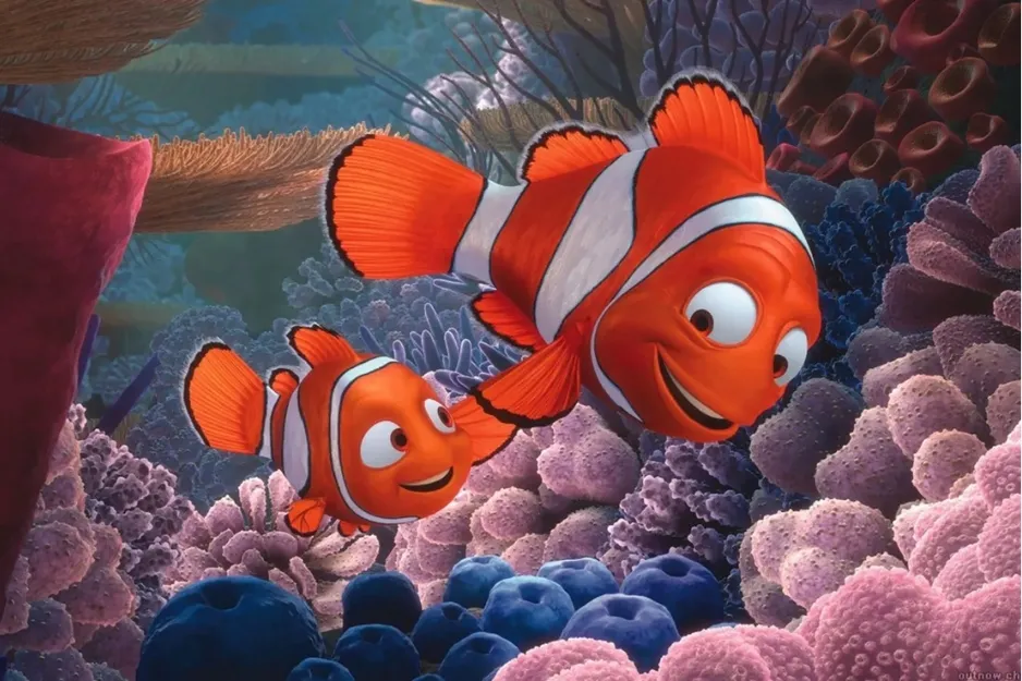 Two clownfish swimming through colorful coral reef, a scene from Pixar’s Finding Nemo animated movie.