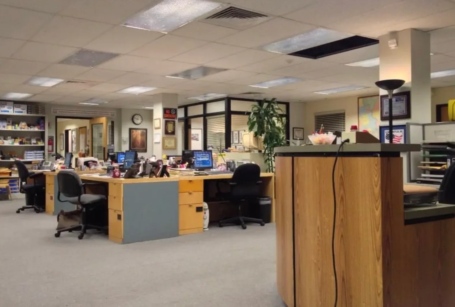 Open office workspace from The Office (US) TV show, featuring desks, computers, and typical office decor.