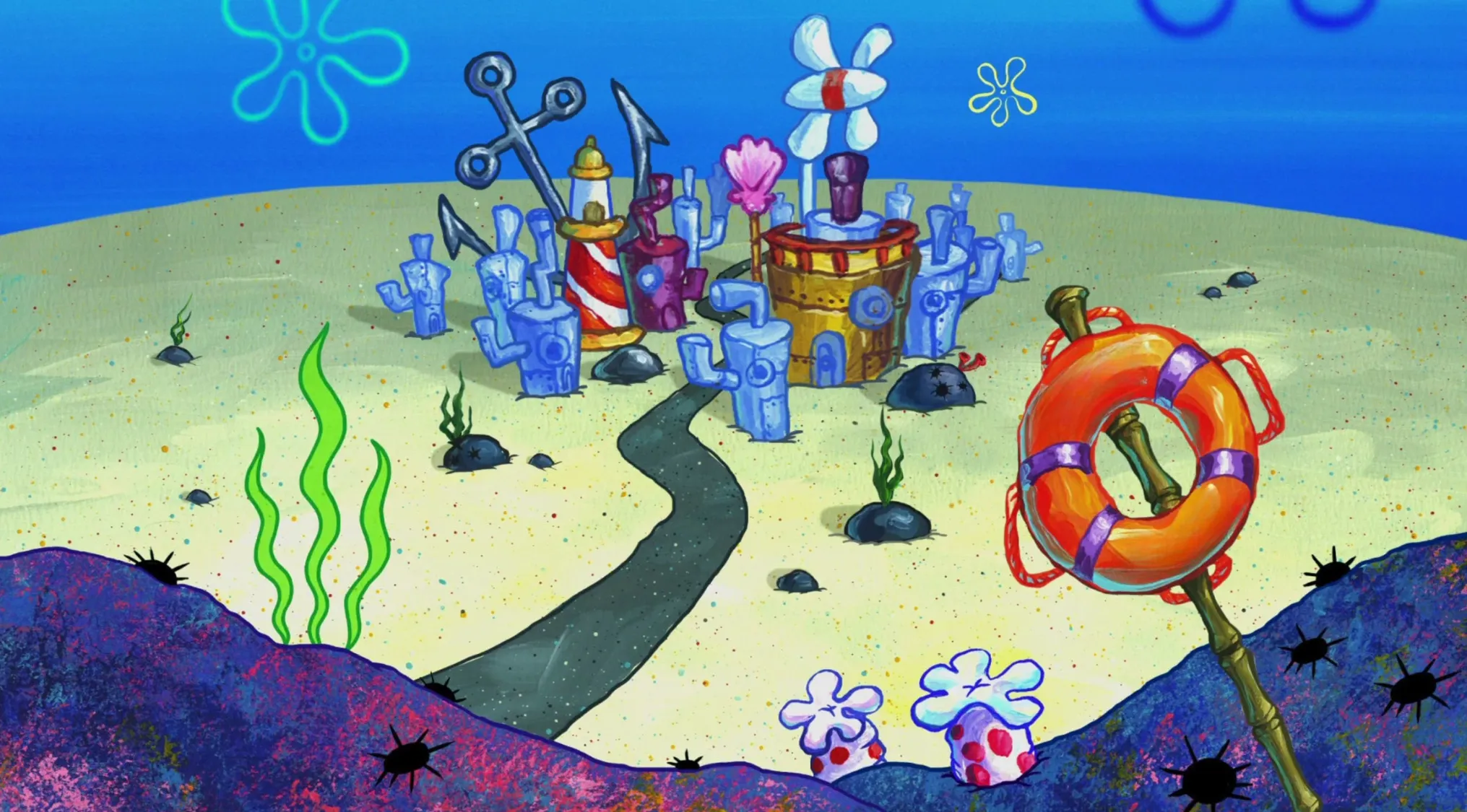 Underwater view of the fictional city of Bikini Bottom from the animated TV show SpongeBob SquarePants with colorful buildings and sea plants.