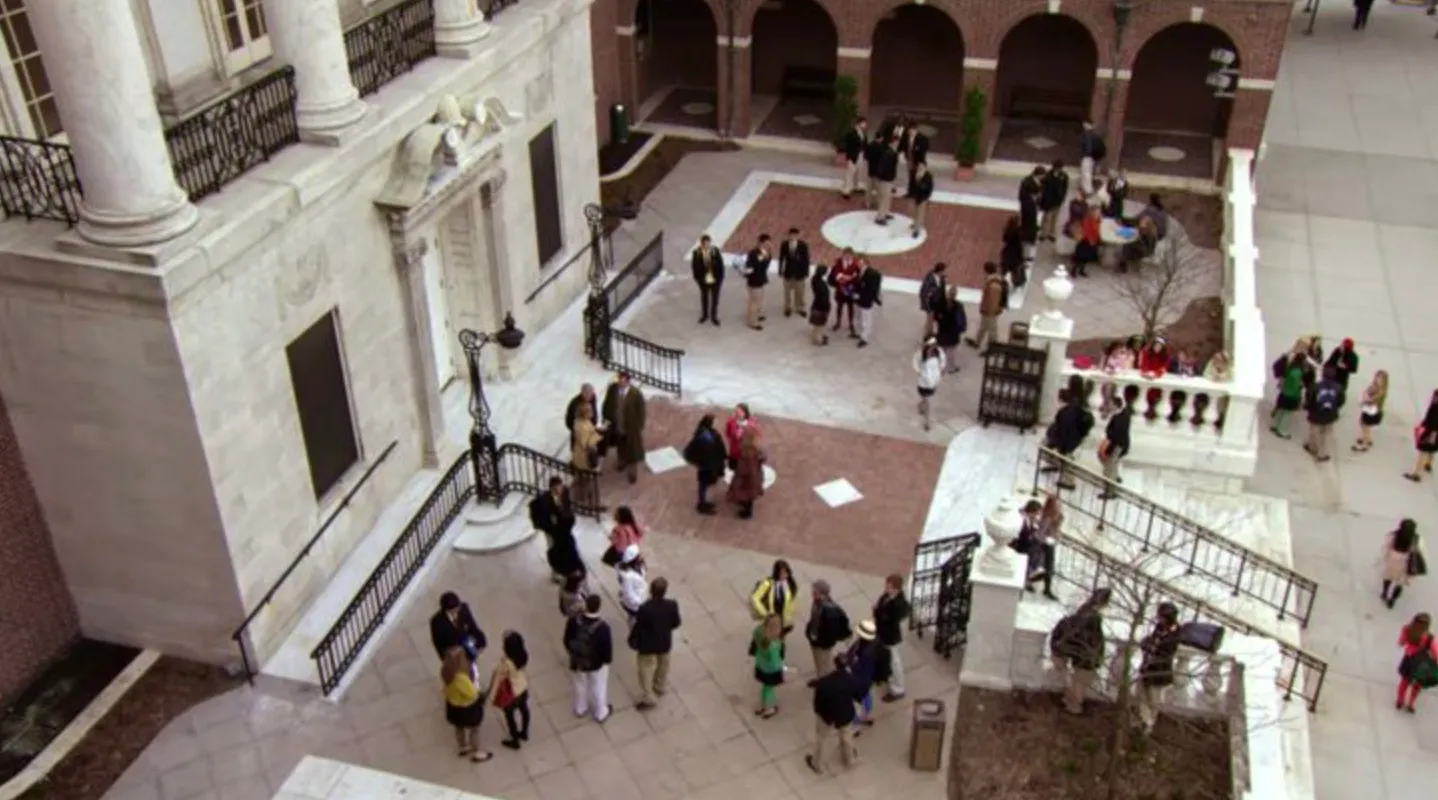 Students and staff outside Constance Billard School courtyard, a fictional location in popular TV shows.