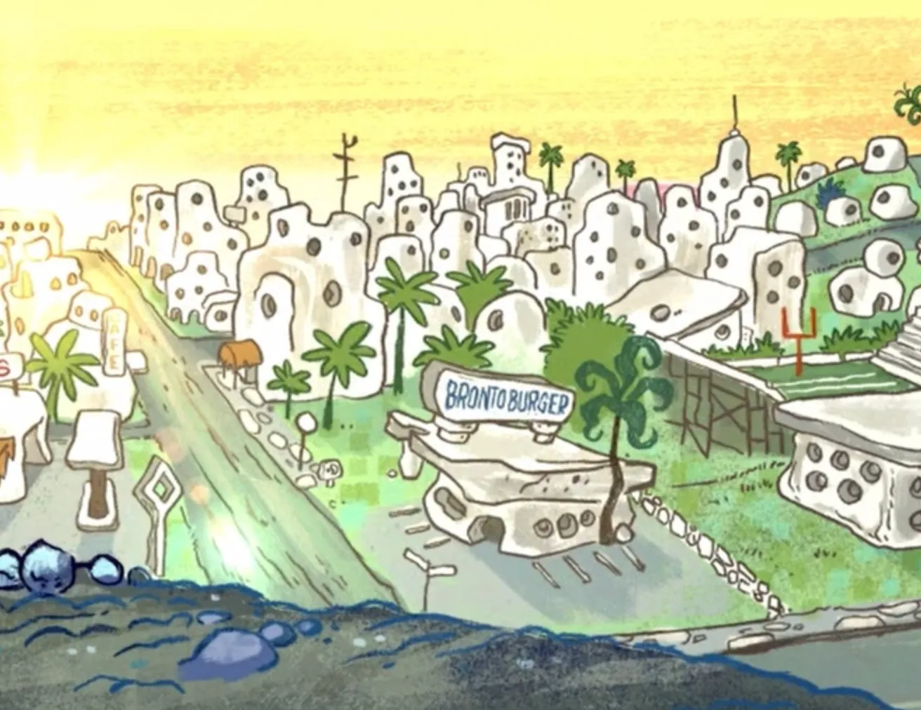 Bedrock city from the Flintstones shown with stone buildings, palm trees, a road, and a Bronto Burger restaurant sign.