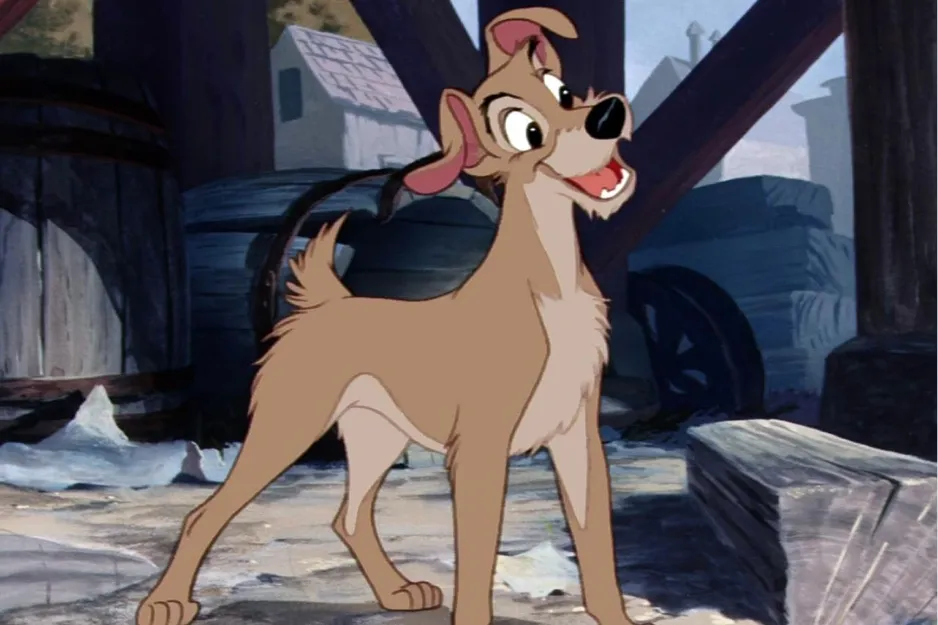 Animated character Tramp from Lady and the Tramp smiling and standing in a rustic outdoor setting.
