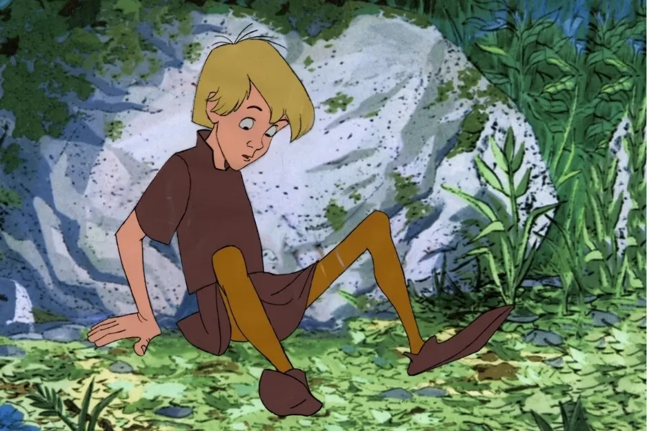 Young Arthur sitting by a stone in a forest setting, beginning his magical journey after pulling the sword.