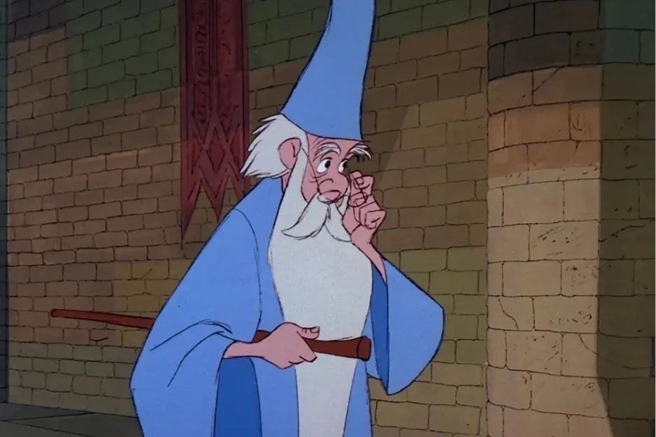Merlin in blue robe and hat, adjusting glasses inside a stone castle with medieval brick walls.