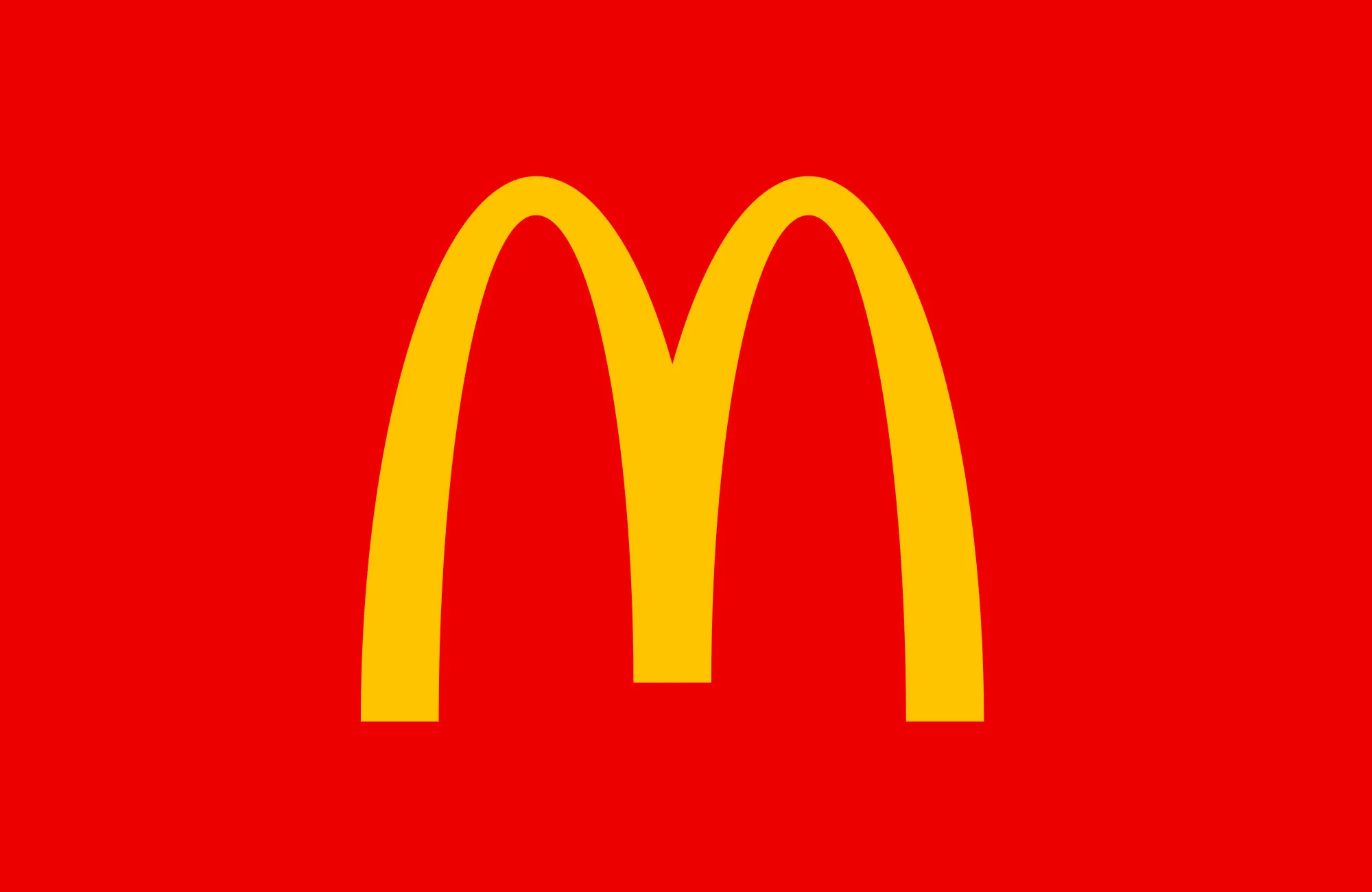 Golden arches logo of McDonald's on a red background representing the global fast-food chain brand.