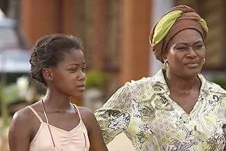 Two South African women standing outside, depicting a scene from the film Life Above All, which won a 2006 Academy Award.