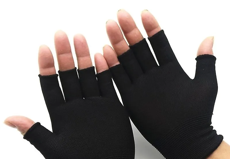 Hands wearing black fingerless gloves, a fashion accessory emblematic of the late-1990s teen pop era.