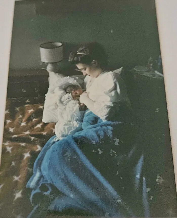 A mother cradling her newborn baby in bed, painted in classic Accidental Renaissance style.