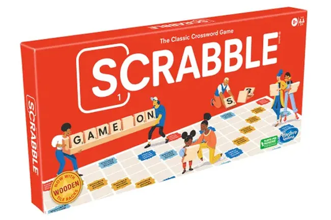 Scrabble board game box with players holding letter tiles spelling words on a game board for a classic game night.