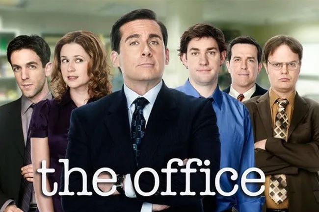 Cast of The Office posing in an office setting promoting the comfort TV rerun popular for workplace comedy fans.
