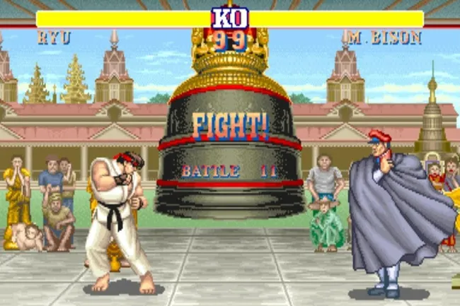 Street Fighter II gameplay screen showing characters Ryu and M. Bison in a classic arcade fighting scene.