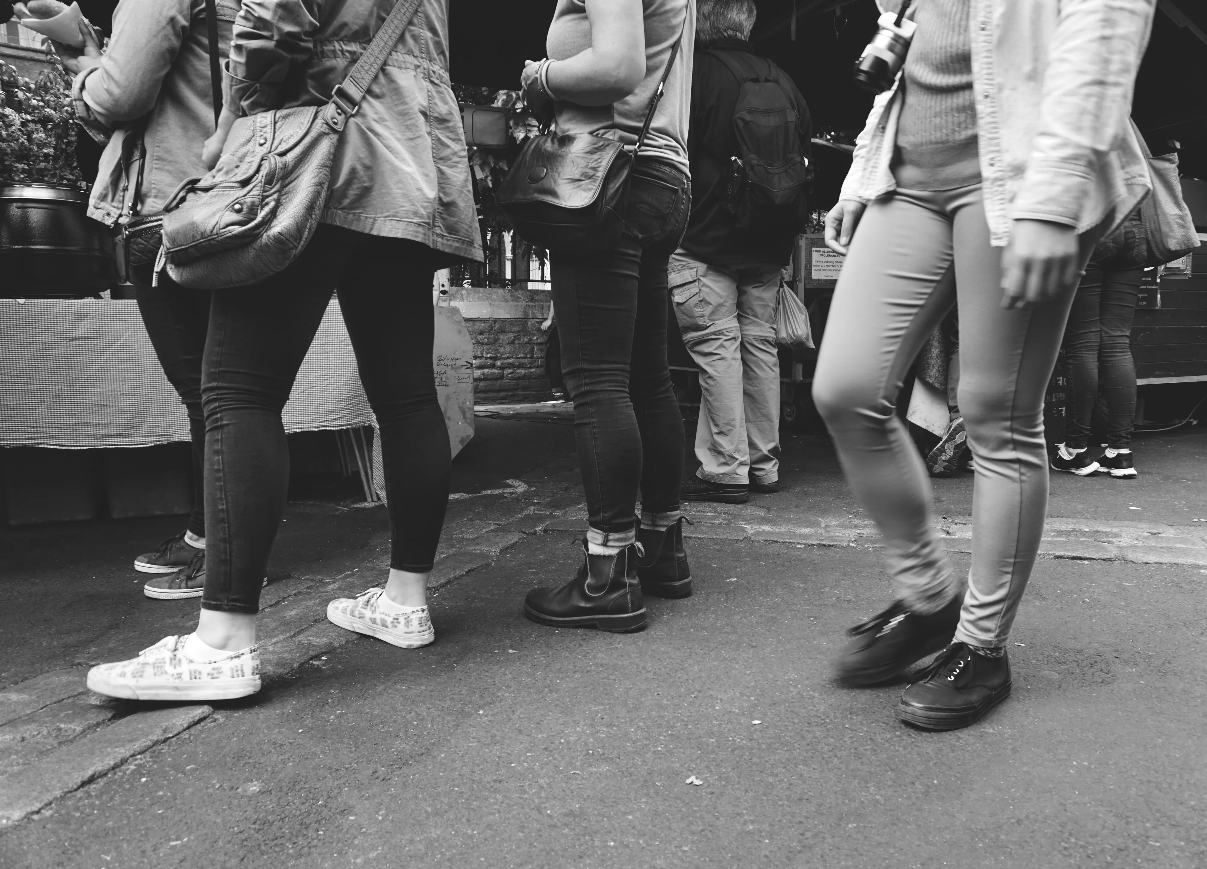 People standing in line at a coffee shop, illustrating psychological defense mechanisms in social situations.