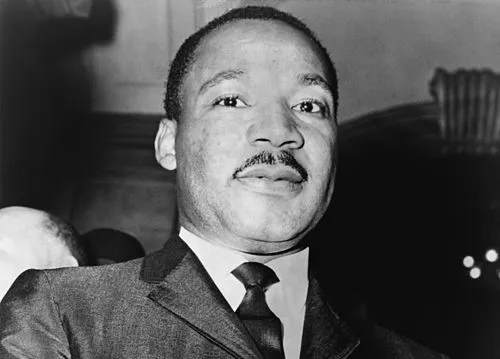 Martin Luther King Jr. delivering the I Have a Dream speech in Washington D.C., captured in a historical black and white photo.