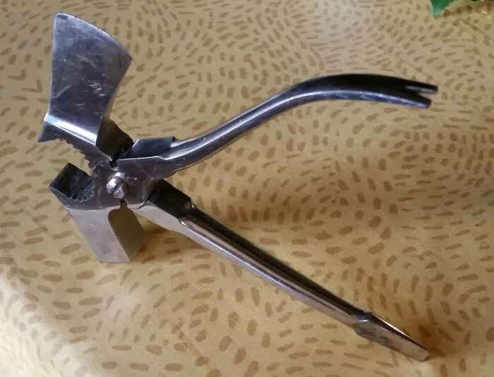 This Tool Is Both A Hammer, A Hatchet, A Screwdriver, A Nail Puller, And Pliers