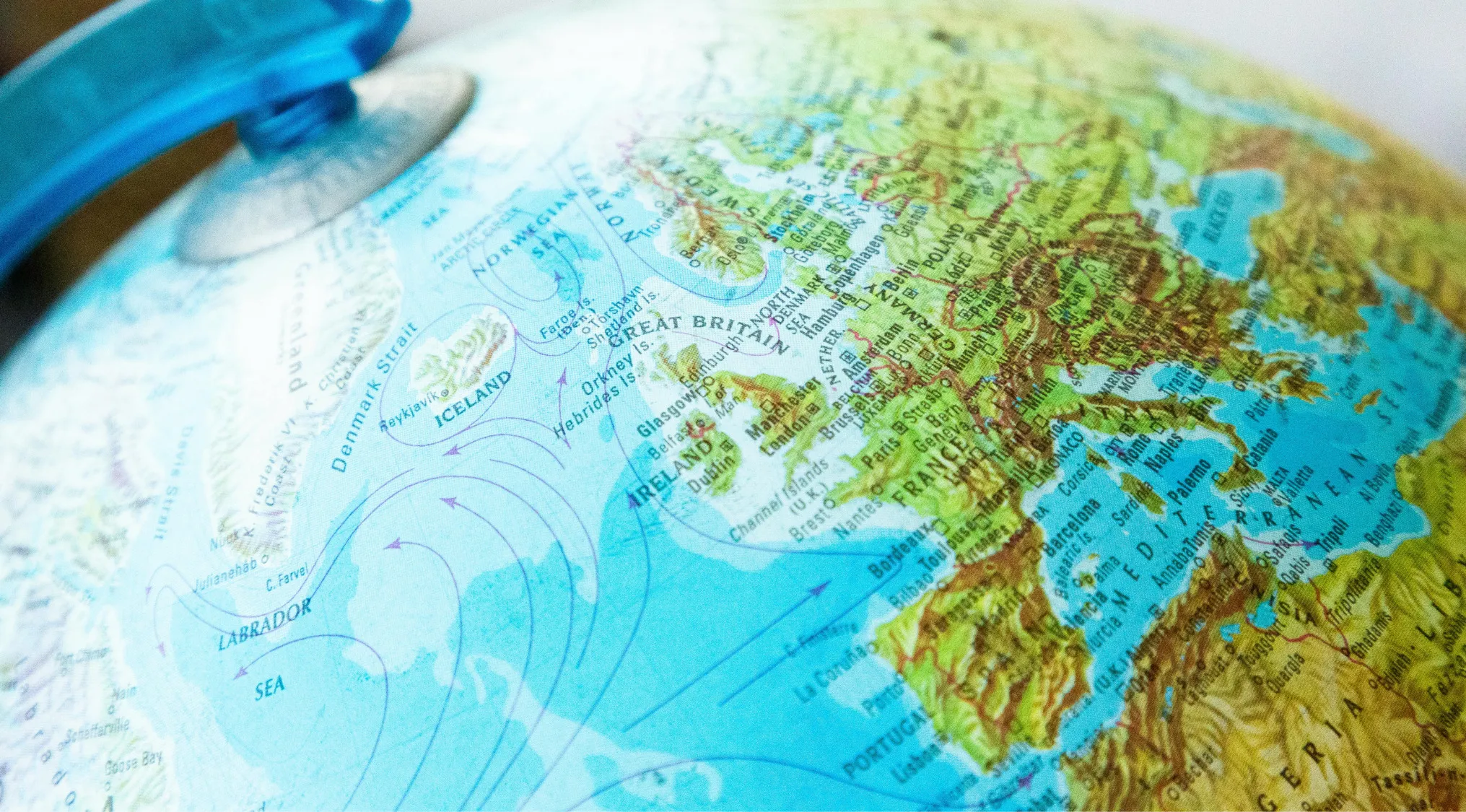 Close-up of a globe showing Europe and surrounding seas, illustrating countries often mixed up like Swaziland and Eswatini.