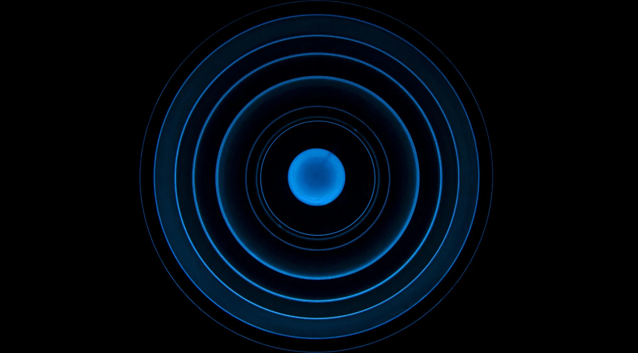Concentric blue circles radiating from a central sphere, representing advanced placement school quiz biology concepts.
