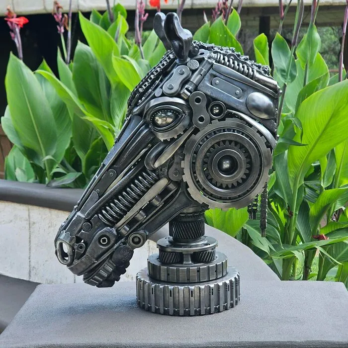 Metalworker's remarkable sculpture of a horse head made from intricately assembled mechanical parts and gears.