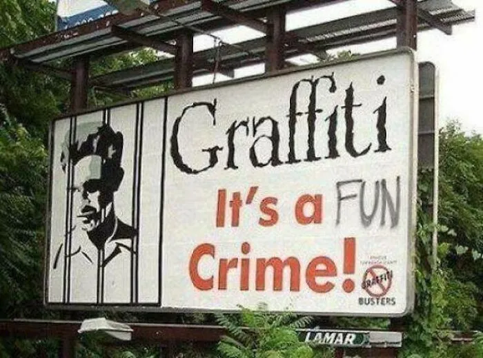 Sign reading graffiti is a crime altered with the word fun graffiti showing a strange and unusual street message.