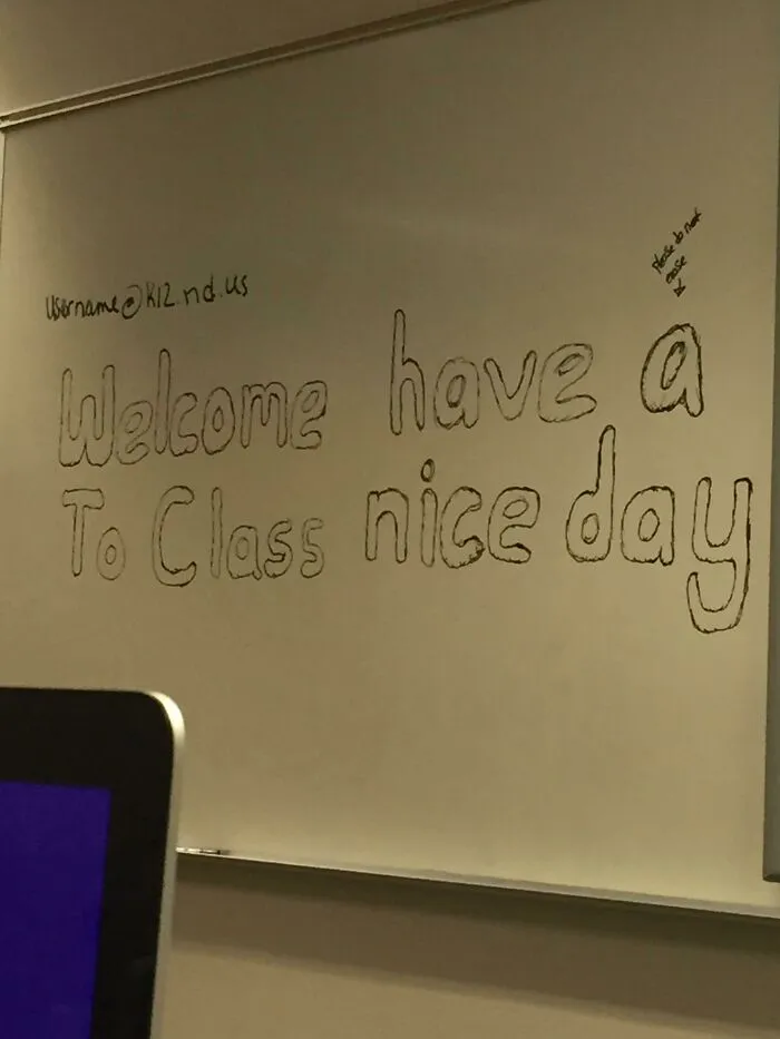 Handwritten sign on whiteboard with confusing phrase that went wrong, creating comedic gold in a classroom setting.