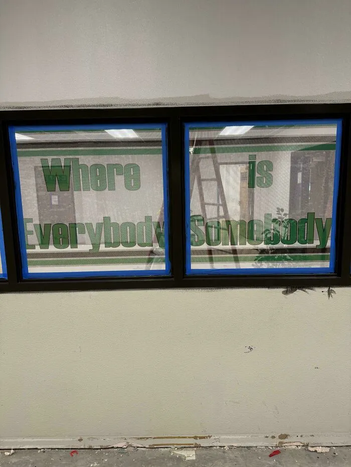 Window signs with misplaced words that went wrong, creating comedic gold with confusing text layout.